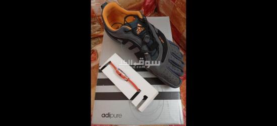 اديداس اديبور اورثولايت اوريجينال Adidas Adipure Gray Orange with ionloop   wristband size m orange